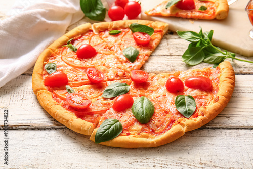 Board with tasty pizza marg...