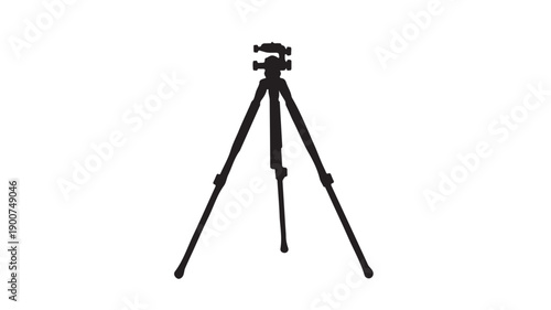Black camera tripod in studio shot with neutral lighting on white background for photography equipment