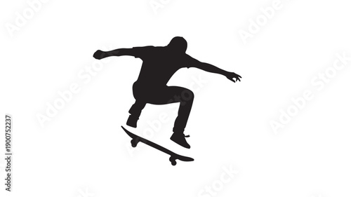 Silhouette of a skateboarder performing a trick.