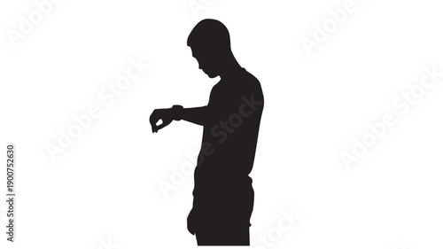 A man standing and holding a smartphone in his hand.