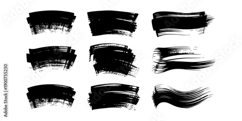 Collection of nine black ink brush strokes with textured edges isolated on a white background.