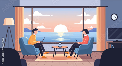 Two people work on laptops facing a sunset over the ocean