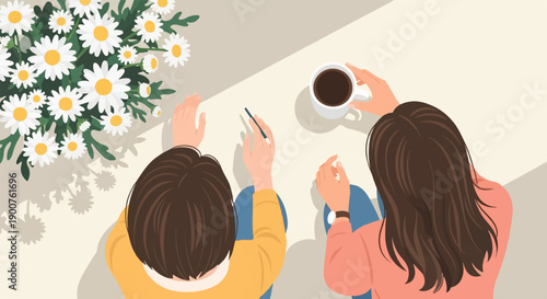 Two people share coffee and daisies at a table, one writing