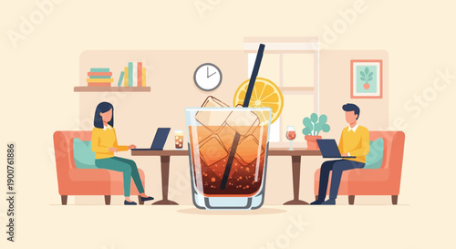 Two people working on laptops beside a large iced drink