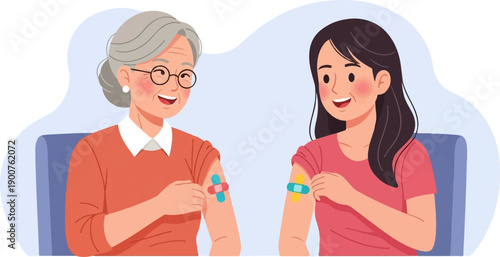 Two happy women, an elder and a younger one, showing vaccination band-aids