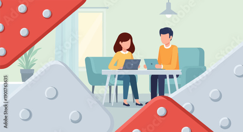 Two colleagues collaborate on laptops at a table in a modern office