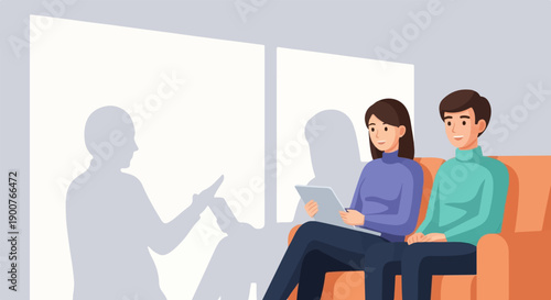 Two people on a sofa looking at a tablet, with shadows on a wall