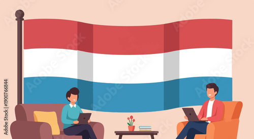 Two men work remotely on laptops in front of a large waving flag