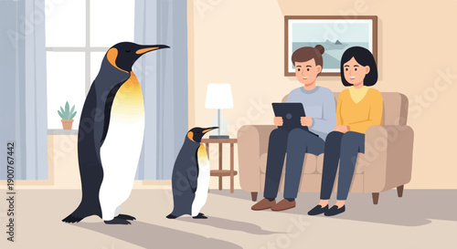 Two penguins observe a couple relaxing indoors with a tablet