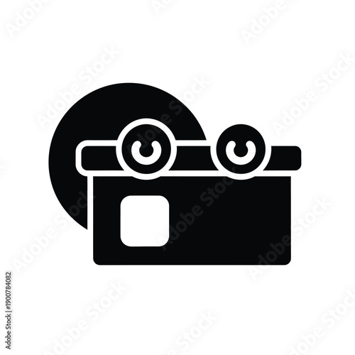 A black and white icon of a film camera with a cd behind it