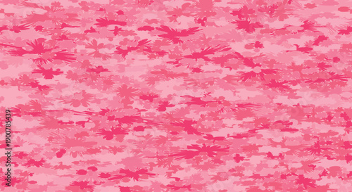Abstract pink floral pattern with scattered, blurred blossom shapes.