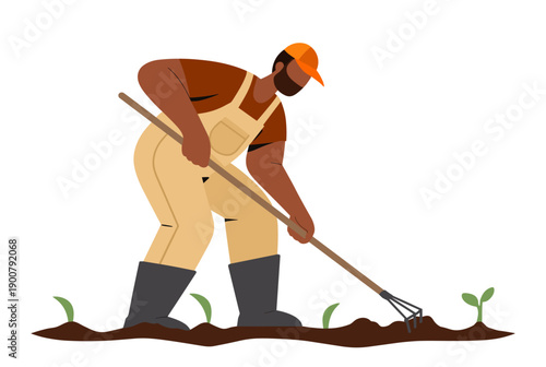 Farmer tilling soil with rake