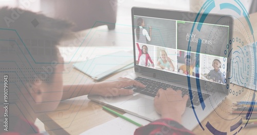 Typing child in red plaid leaning toward laptop at home desk, with fingerprint graphic, copy space