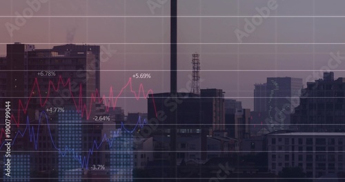 Displaying skyline through window mullion at dusk from office, with red-blue charts and grid