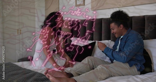 Smiling couple sharing phone in bedroom, in denim jacket and white dress with pink AR overlay