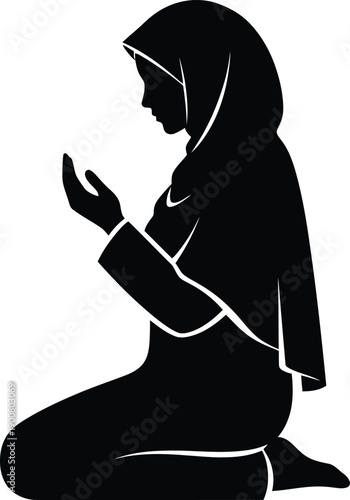 Silhouette of a woman in hijab praying in black