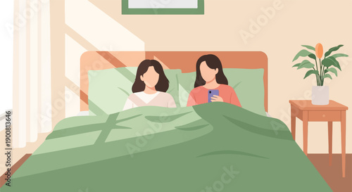 Two women in bed, one using a phone
