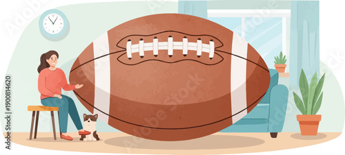 Woman and dog near a giant football in a living room