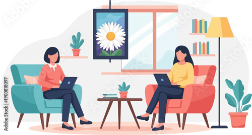 Two women sitting in comfy chairs using laptops, surrounded by home decor