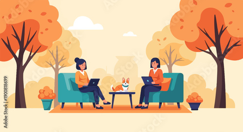 Two women with a dog working on laptops in a park during autumn