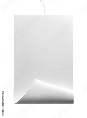 White rectangular paper sheet with curled corner, held by thin string, isolated on black