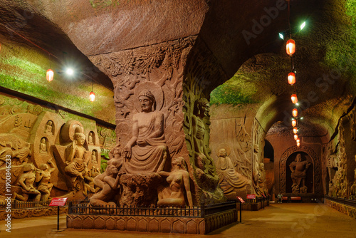 Fotografie Sculpture of Gautama Buddha surrounded by voluptuous women, underground palace,