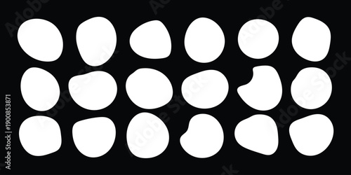 Diverse collection of white irregular organic shapes on a black background, for abstract graphic design.