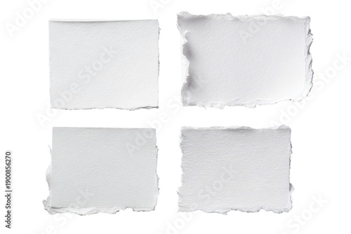 Four torn, textured white paper squares arranged in a 2x2 grid, on black background