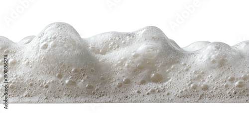 Close-up of frothy white bubbles with varying sizes, against a black background