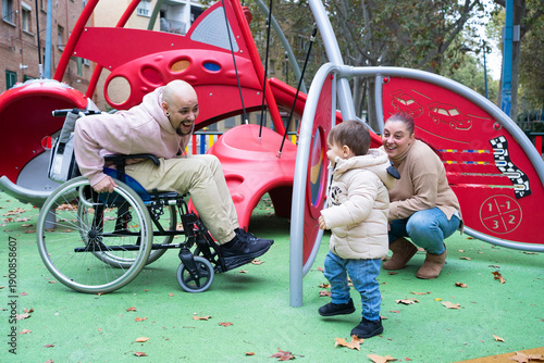 Photography Family playing at accessible playground creating inclusion