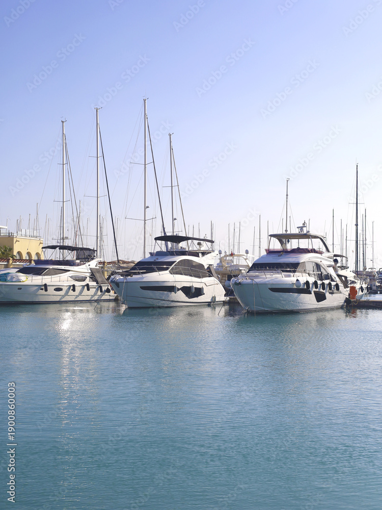 Fototapeta premium Sunlit Marina With Luxury Yachts at Anchor
