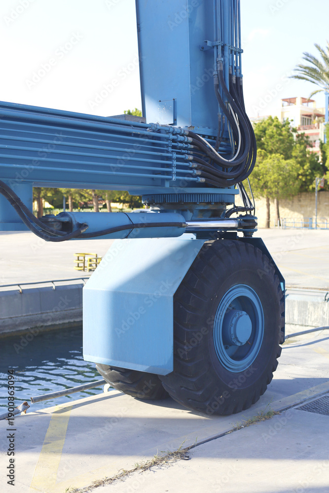 Fototapeta premium Large Blue Harbor Crane Wheel Closeup