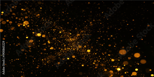 Shiny water drops on a black background create a sparkling winter bokeh pattern with bright gold and blue glitter particles for a holiday night wallpaper design