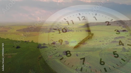 On start clock hands sweeping clockwise over faint dial, indicating time passing fast across fields