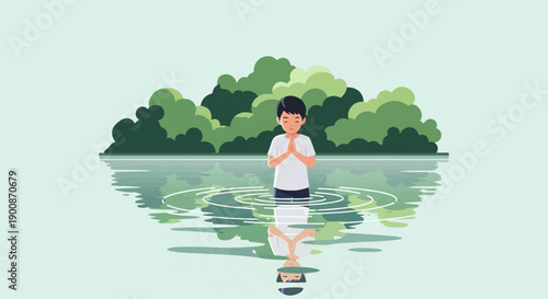 A boy stands in water, hands pressed together, reflecting in the calm surface