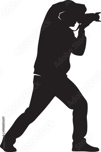 Silhouette of a photographer intensely focused while taking a picture