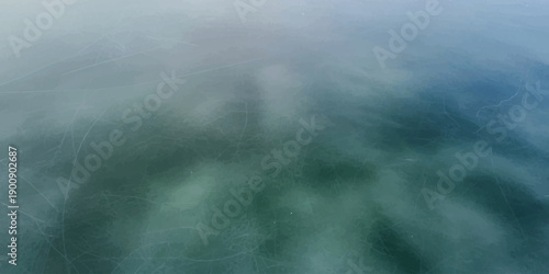 Hazy and ethereal abstract background created by intentional camera movement over a tranquil water surface.