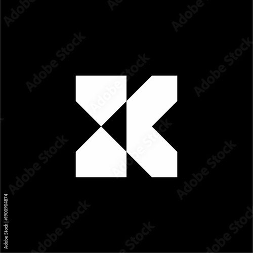 Geometric "K" utilizing mirrored blocks to form a sleek, futuristic hourglass silhouette.