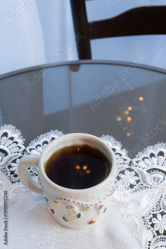christmas cup of coffee on glass round table