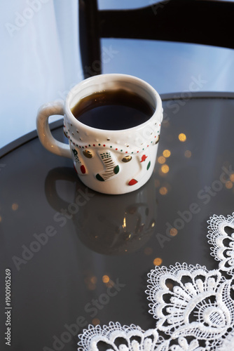 christmas cup of coffee on glass round table