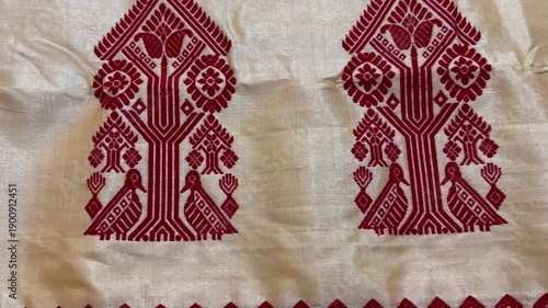 Close up shot of traditional Assamese Toss Muga Chador , Toss Muga Sadoris a premium and traditional attire of Assamese culture, worn mainly by women during the Bihu dance.