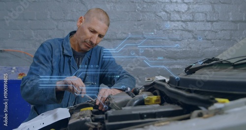 Adjusting mechanic in blue coverall with wrench fastening inside engine bay in garage, with HUD