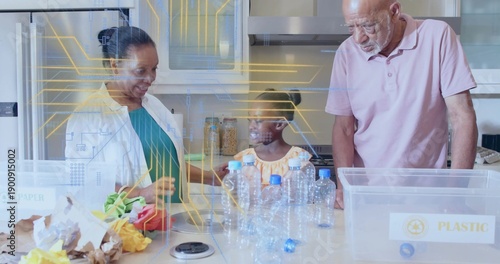 Sorting grandparents and granddaughter arranging plastic bottles in kitchen, child in yellow dress