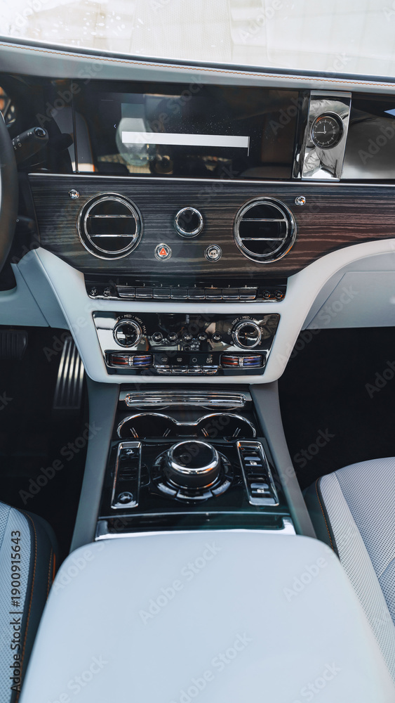 Obraz premium Luxury car interior with modern controls and dashboard design for comfortable driving experience