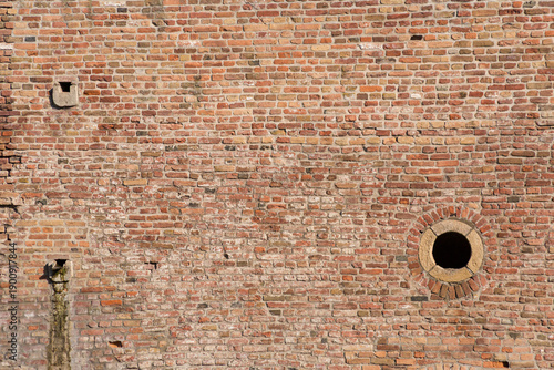 Wallpaper Mural Textured vintage background. An old brick wall with a round hole in the lower right corner. Torontodigital.ca