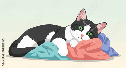 A relaxed black and white cat lounging on colorful fabric