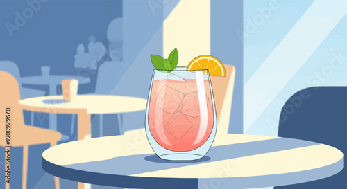 A refreshing pink drink with ice, mint, and orange slice sits on a table