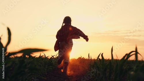 Bilde på lerret child running field sunset, agriculture, little child runs along a green field s