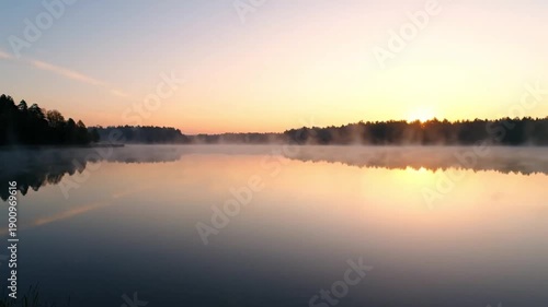 Wallpaper Mural Serene misty lake at sunrise with calm water and trees Torontodigital.ca
