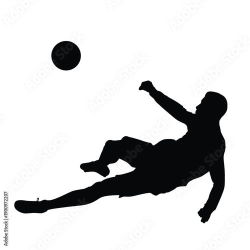 soccer player kicking the ball in silhouette